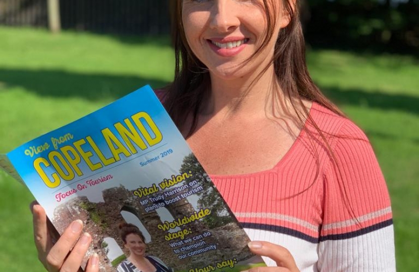 Trudy Harrison Holding Her Tourism Magazine 