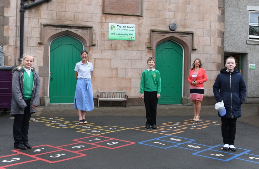    Picture Trudy Harrison speaks to head teacher and pupils at Captain Shaw's primary School, Bootle