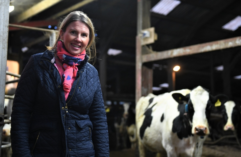 Trudy stood next to a cow