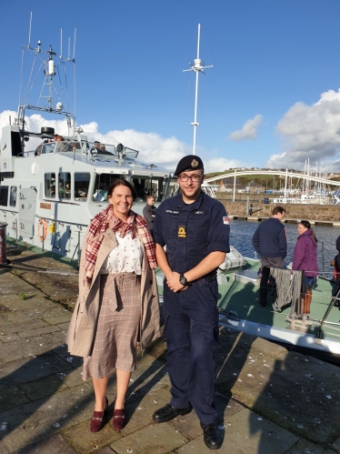 Caption: Trudy Harrison pictured with Lt Matthew Smith during HMS Biter visit