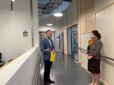 Trudy speaks with BECs Michael Pemberton during tour of newly opened bus station development 